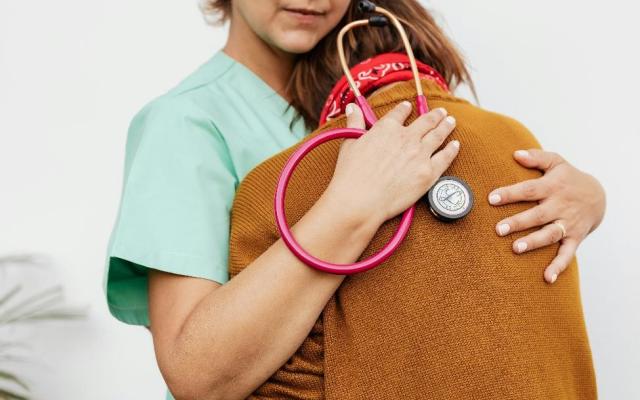 nurse hugging patient